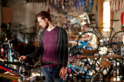 Buy stock photo Business, bicycle and man in store, repair and fix with skills, startup and eco friendly travel. Shop owner, entrepreneur or employee in workshop, merchandise and cyclist with maintenance or engineer