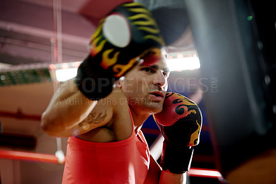 Buy stock photo Power, sports and man with bag for boxing exercise, strong punch and self defense gym. Pads, challenge and boxer in practice for training technique, learning and fitness workout with fighting skills