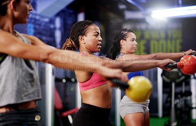 Buy stock photo Gym, exercise or friends in fitness class with kettlebell for strength training, cardio and wellness. Health club, active women or people in workout with equipment for healthy body, goal or wellbeing