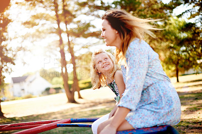Buy stock photo Smile, mother and child on carousel at playground for holiday fun, play games and bonding together. Happy, family and kid on merry go round for spinning ride, activity and balance support on vacation