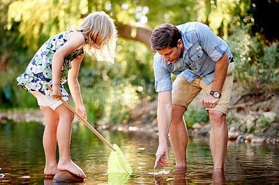 Buy stock photo Father, daughter and fishing with net in river for holiday adventure, teaching skills or instruction. Family activity, single dad and child catch fish in lake with learning, bonding and development