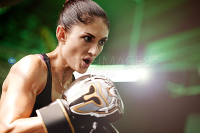 Buy stock photo Woman, fighter or fitness with boxing gloves for workout, intense exercise or self defense in gym. Active, female person or boxer breathing with sweat for martial arts or training in health club