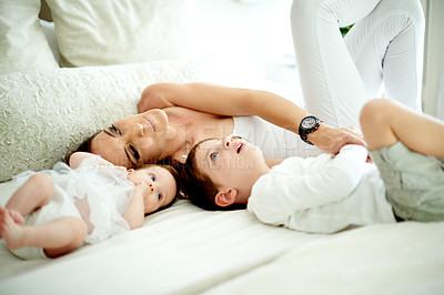 Buy stock photo Baby girl, boy and mother on bed in home together for bonding, family time or relationship. Love, maternity or security with woman, son and daughter in bedroom of apartment for morning wellness