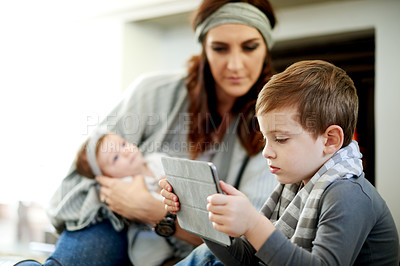 Buy stock photo Tablet, mom and children relax in house for learning, streaming cartoon or video on internet. Tech, kids and parent with baby for online education with app, game or chill with family in living room