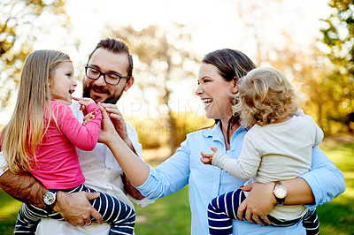 Buy stock photo Parents, family and girls in park, smile and bonding together with happiness, nature and funny. Outdoor, mother and father with kids, development and playing with daughters, summer holiday and love