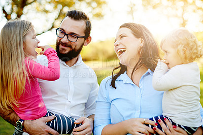 Buy stock photo Parents, funny and family with girls, outdoor and bonding together with happiness, humor and fun. Lens flare, mother and father with kids, laughing and playing with daughters, summer holiday or smile