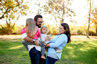 Buy stock photo Park, parents and children in outdoor with bonding, play and relax for summer holiday and vacation. Happiness, father and mother in nature with sunshine, garden and support in marriage on weekend.
