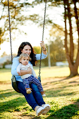 Buy stock photo Swinging, mother and girl in playground, fun ride and bonding together with happiness, games and nature. Family, outdoor and parent with mama, relax and child development in park, smile and care