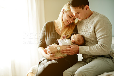 Buy stock photo Bedroom, love and parents with child in home for loving relationship, bonding and affection. Family, morning and happy mom, dad and newborn baby in house for security, trust and parenting together