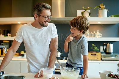 Buy stock photo Cooking, pancake and taste with father and son in kitchen for learning, breakfast and support. Food, ingredients and batter with man and child with bowl in family home for teaching, bonding and love
