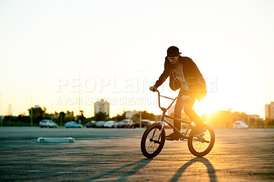 Buy stock photo Balance, BMX and flare with man on bike in city for activity, adrenaline hobby or sports training. Exercise, ride and risk with extreme person on bicycle on street for action, cycling or energy