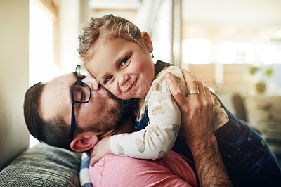 Buy stock photo Kiss, father and daughter in home with hug, bonding together and parent safety in connection. Portrait, support and happy people in living room with embrace, love and trust for childhood development.