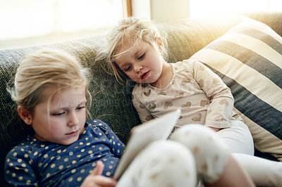 Buy stock photo Tablet, relax and children on sofa in home for playing educational game on app for learning. Digital technology, bonding and girl kids with online entertainment together in living room at house.