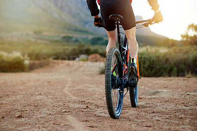 Buy stock photo Man, bicycle and athlete legs in nature, outdoor fitness and exercise journey on terrain. Male person, wheels and travel to countryside for off road challenge, cardio sports and practice on space