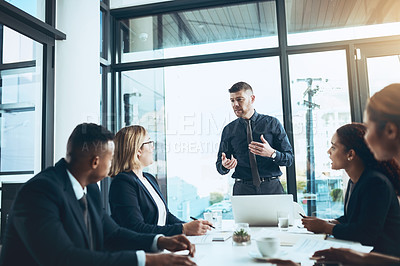 Buy stock photo Businessman, team and meeting with presentation in boardroom, speech and group with attention. Collaboration, leader and explaining with listening, strategy and discussion for project in office