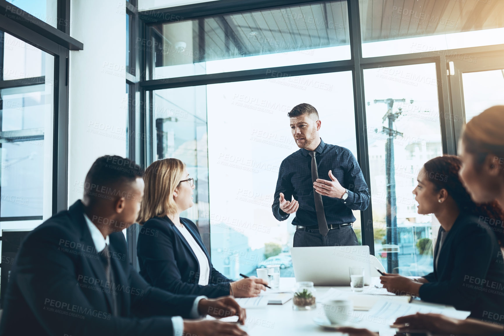 Buy stock photo Businessman, team and meeting with presentation in boardroom, speech and group with attention. Collaboration, leader and explaining with listening, strategy and discussion for project in office