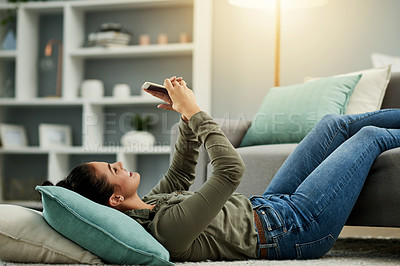 Buy stock photo Smile, woman and relax with phone at house for research, browsing social media and reading ebook. Female person, mobile and screen for surfing internet, texting contact and entertainment subscription