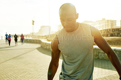 Buy stock photo Stretching, exercise outdoor and man on promenade for run, race training and fitness goals. Thinking, workout and male person in nature for wellness, warm up and marathon preparation with lens flare.