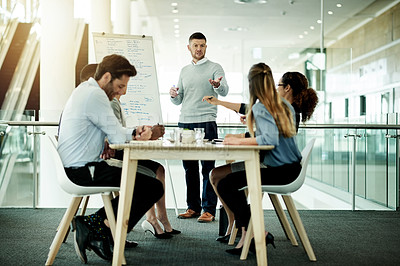 Buy stock photo Meeting, presentation and question with business man in office for whiteboard, timeline and project progress. Speaker, planning and schedule feedback with employees for brainstorming proposal