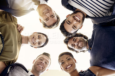 Buy stock photo Below, portrait and business people with smile, collaboration and teamwork for company goals. Happy, group and employees together in huddle with unity, solidarity and motivation for problem solving.