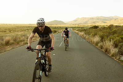 Buy stock photo People, cyclist and bicycle on road in nature for fitness, exercise or outdoor sport. Active man, woman or biker on street or path for cycling marathon, race or cardio workout together in countryside