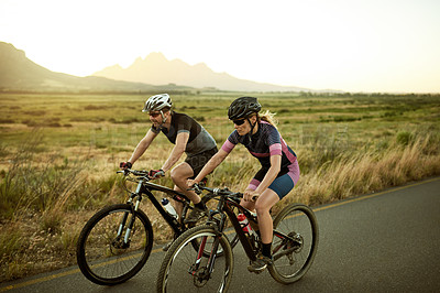 Buy stock photo Couple, cyclist and bicycle on road in nature for fitness, exercise or outdoor sport. Active man, woman or biker on street or path for cycling marathon, race or cardio workout together in countryside