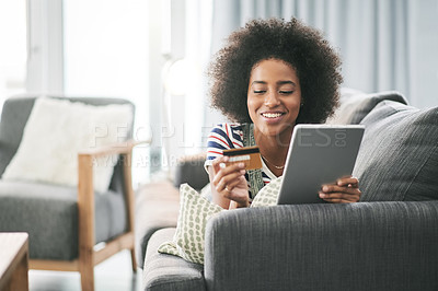 Buy stock photo Happy, black woman and credit card with tablet for online shopping or payment on sofa in home. Female person, shopper or user with smile, debit or technology for ecommerce or remote banking in house