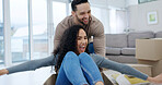 Happy, couple and playing with box in new home for relocation, mortgage or moving in together. Man, woman or relationship with smile in package or parcel for bonding or property ownership in house