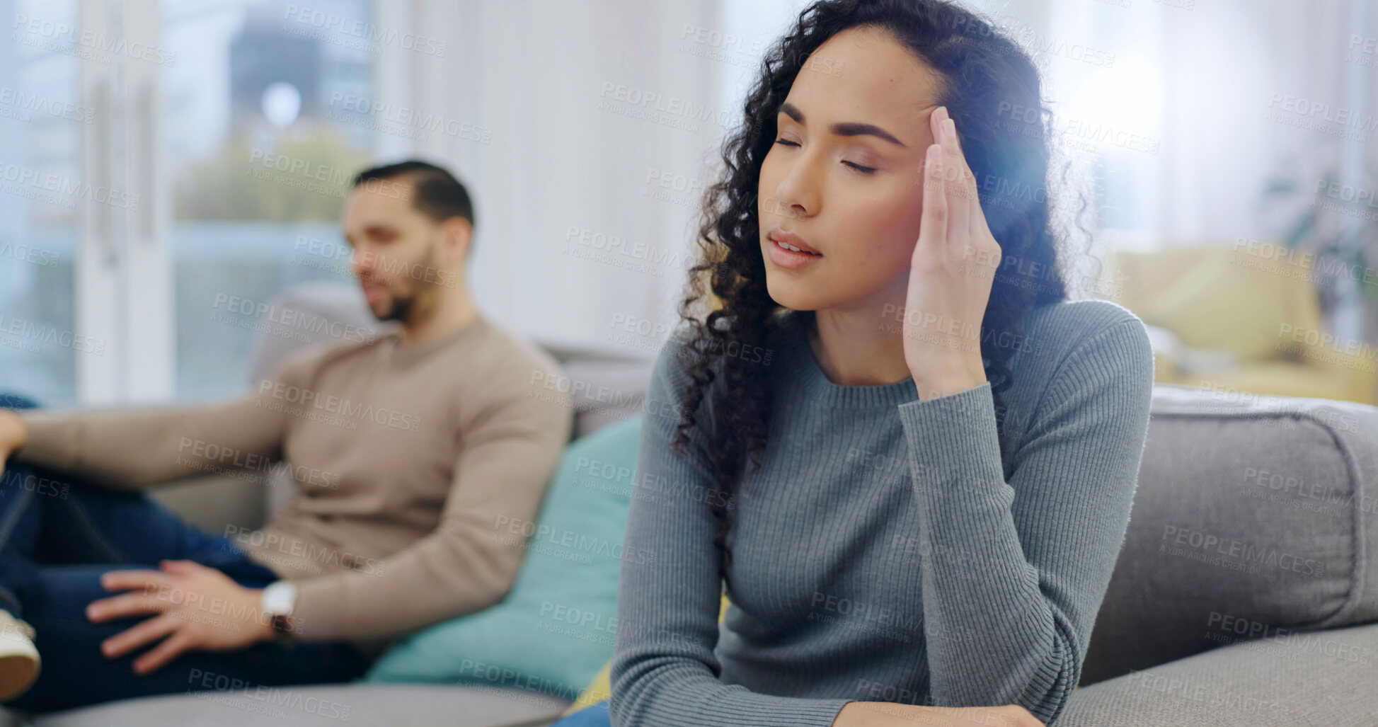 Buy stock photo Headache, woman and couple on sofa with conflict, betrayal and silent treatment for cheating. Ignore, wife and migraine in home for overthinking affair, toxic marriage and frustrated for gaslighting