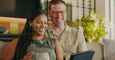 Buy stock photo Relax, smile and tablet with interracial couple on sofa for streaming service, bonding and love. Film subscription, connection and happy with man and woman in living room in home for media app