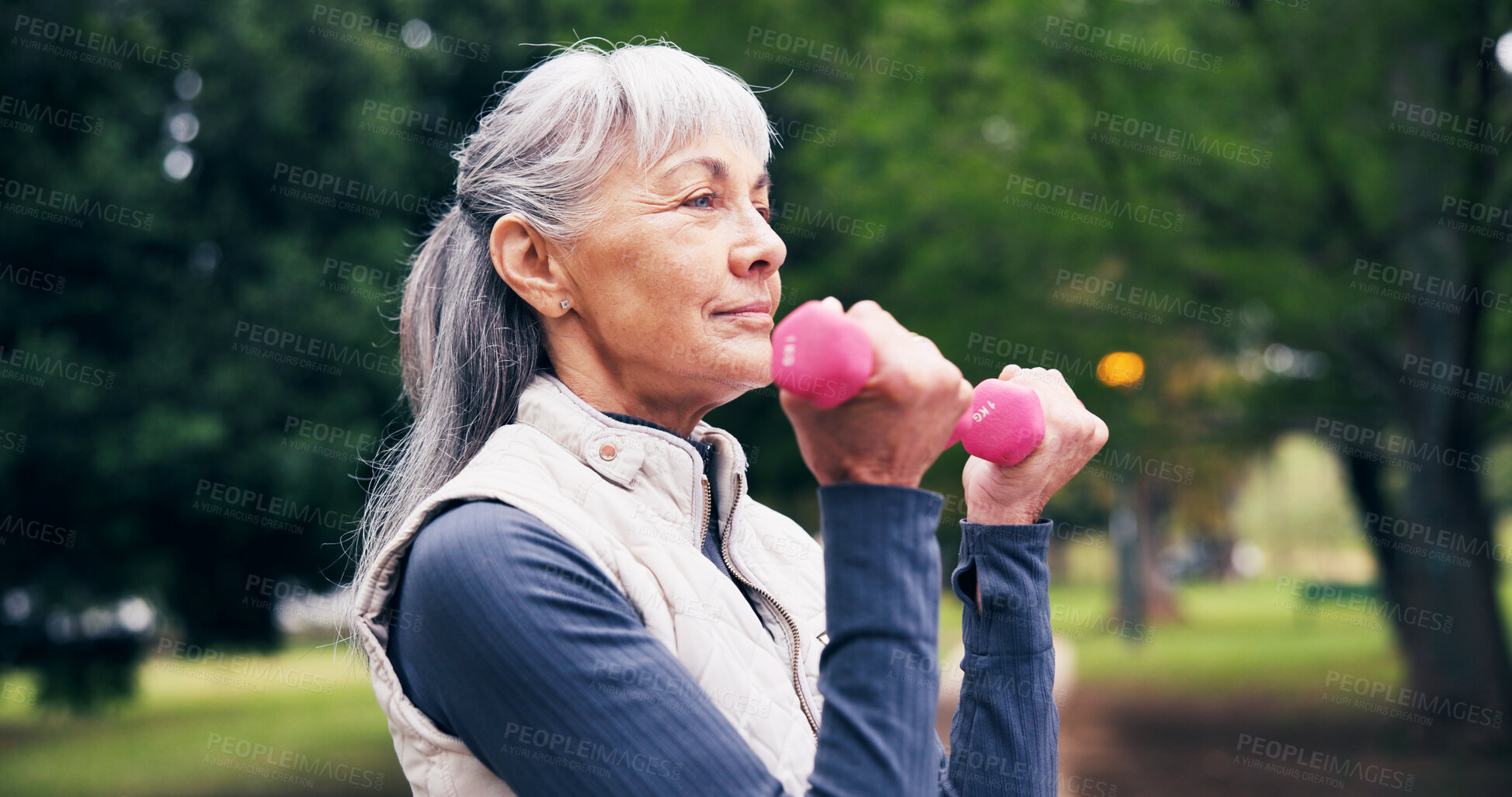 Buy stock photo Outdoor, exercise and senior woman with dumbbells, endurance or fitness routine for health in nature. Park, wellness and retired person with equipment for workout, training and physical activity