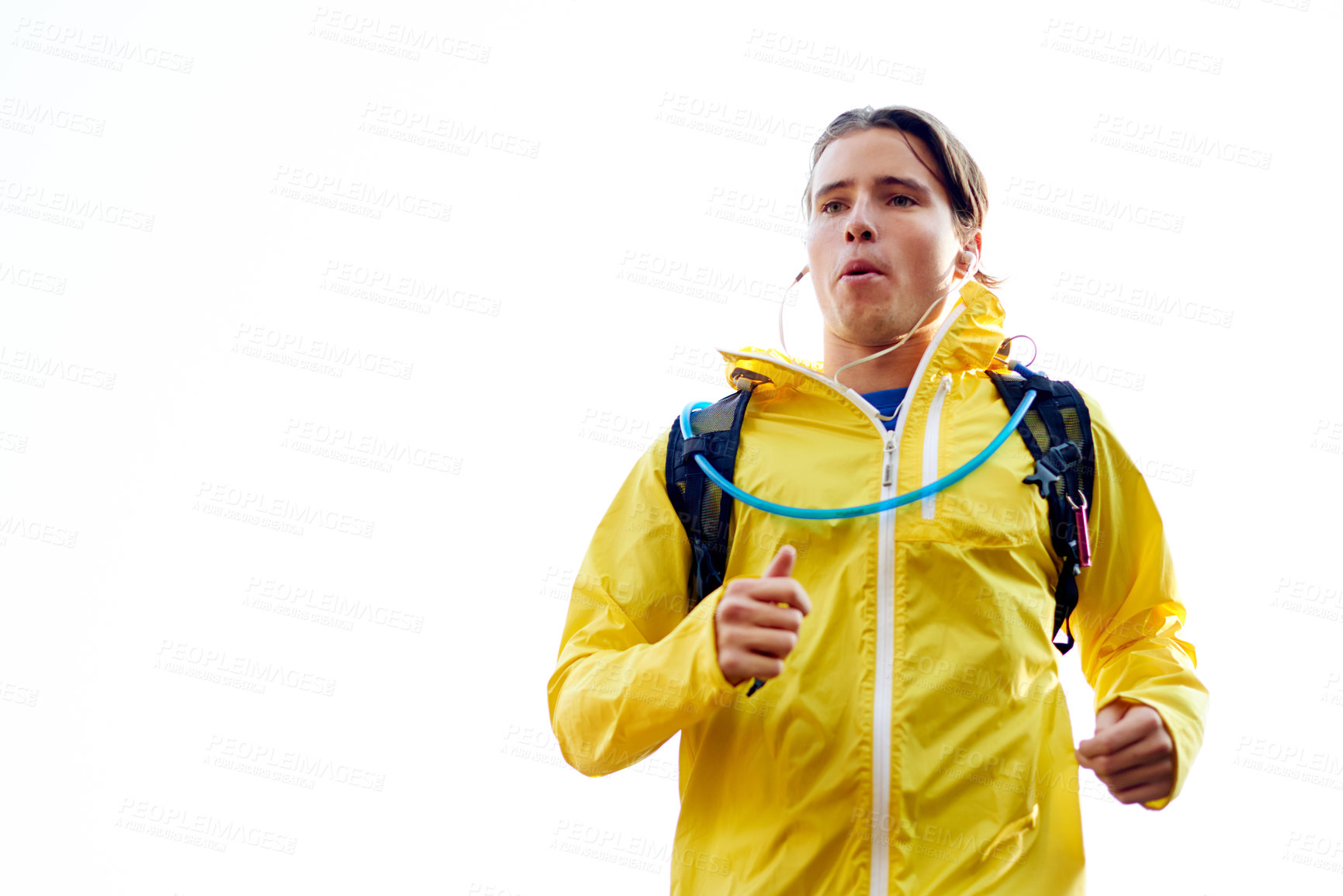 Buy stock photo Outdoor, space and man running with fitness for exercise, morning routine or workout with jacket. Mockup, breathe or athlete in cardio training with sportswear on mountain trail in woods for wellness