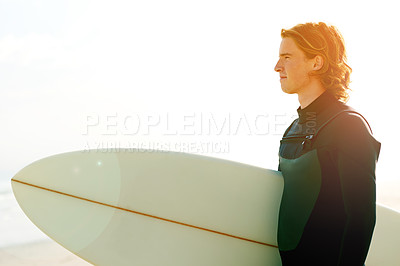 Buy stock photo Surfboard, fitness and man by beach for exercise, training or holiday activity for wellness. Sunset, swimsuit and male athlete by ocean for surfing, flare or water sports on tropical vacation.
