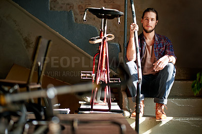 Buy stock photo Portrait, garage and man with tools, bike repair and maintenance with skills, tools and workshop. Person, entrepreneur or business owner with restoration expert, fixing or bicycle with equipment