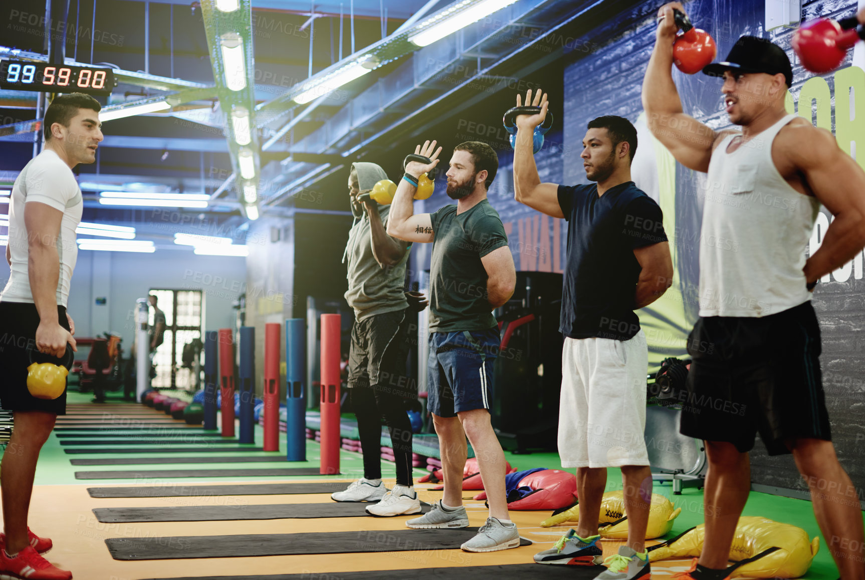 Buy stock photo Kettlebell, coaching and fitness with people at gym for bodybuilder bootcamp, training and workout. Personal trainer, weightlifting and exercise class with group of athletes in sports club for health