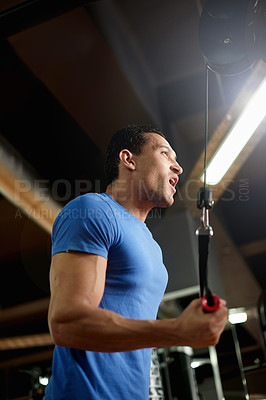 Buy stock photo Training, strong and machine with man in gym for cable pulley, fitness and muscle development. Workout equipment, athlete and exercise with intense person in sports club for bodybuilder reps