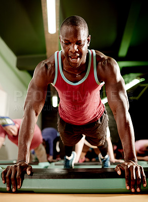 Buy stock photo Black man, plank and exercise on floor at gym with training, challenge and muscle development. African person, core workout and balance with low angle for abdomen, fitness and bodybuilder at club