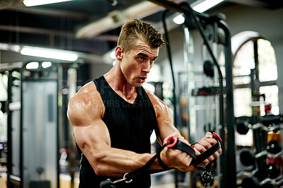 Buy stock photo Exercise, man and machine for bodybuilder, workout and fitness in gym for health and power. Sport person, weightlifting and performance for muscle development, challenge or training for wellness