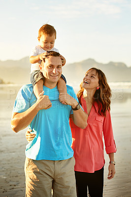 Buy stock photo Travel, parents and child on shoulder at beach for weekend adventure, holiday break or support. Happy family, fresh air and dad carry baby on seashore for vacation, walking together and relationship
