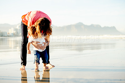 Buy stock photo Beach, mother and boy with vacation, travel and bonding together with adventure. Family, ocean and parent with child, mama and summer holiday with space, help and support with toddler in Zanzibar