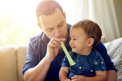 Buy stock photo Dad, son and party with whistle for birthday, childhood or bonding on sofa in home. Father, child and horn for celebration, love and fun in living room of house for event together with happiness