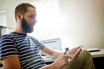 Buy stock photo Web designer, research or man on tablet in office for software system or online update. Internet, developer or backend engineer reading with technology for IT, review or company homepage development
