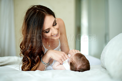 Buy stock photo Bed, cuddle or relax with baby and mother in home together for bonding, growth or love. Development, security and smile of woman parent with infant child in bedroom of apartment for connection