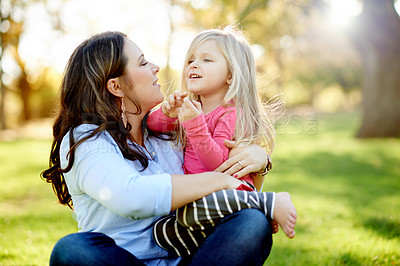 Buy stock photo Love, mother and hug kid at park for safety, security and bonding with girl on vacation. Nature, mom and carry child with embrace for connection, support and talking on family holiday with parent