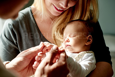Buy stock photo Care, holding hands and parents with baby in home with calm, relax and love in family time. Bonding, smile and newborn sleeping with mother and father for support, comfort or trust together in house.