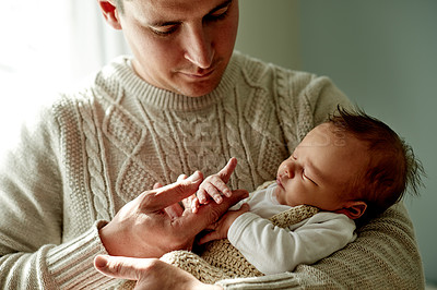 Buy stock photo Love, holding hands and dad with baby in home for loving relationship, bonding and support. Family, parenting and newborn with man together for connection, affection and trust for fatherhood in house