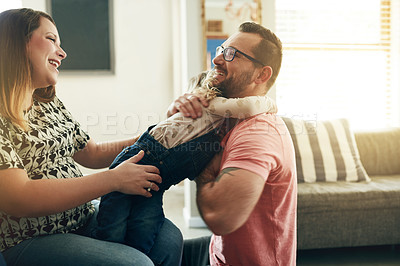 Buy stock photo Smile, parents and hug kid at house for love, trust and bonding together with father safety. Happy, people and embrace child on sofa for security, care and family connection with affection in lounge