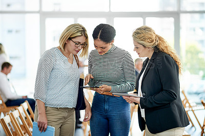 Buy stock photo Business women, tablet and planning at convention for discussion, insurance review and report. Team, conference and conversation with tech at workshop for policy, development or feedback in office