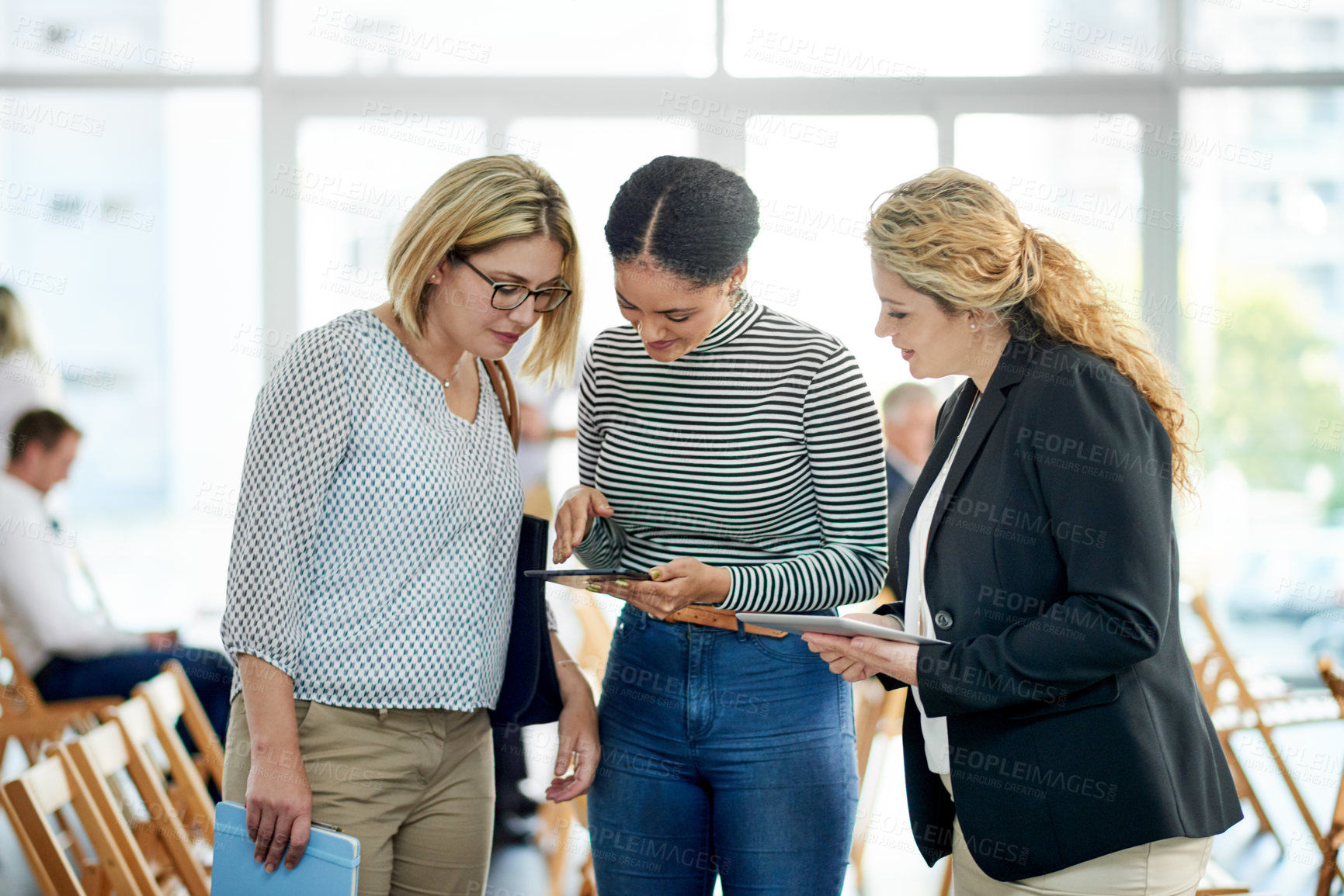 Buy stock photo Business women, tablet and planning at convention for discussion, insurance review and report. Team, conference and conversation with tech at workshop for policy, development or feedback in office