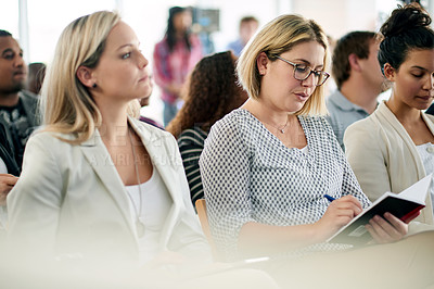 Buy stock photo Business, woman and writing notes in workshop for training, career development and schedule update. Person, employees and notebook for corporate convention, learning session and forum for tradeshow